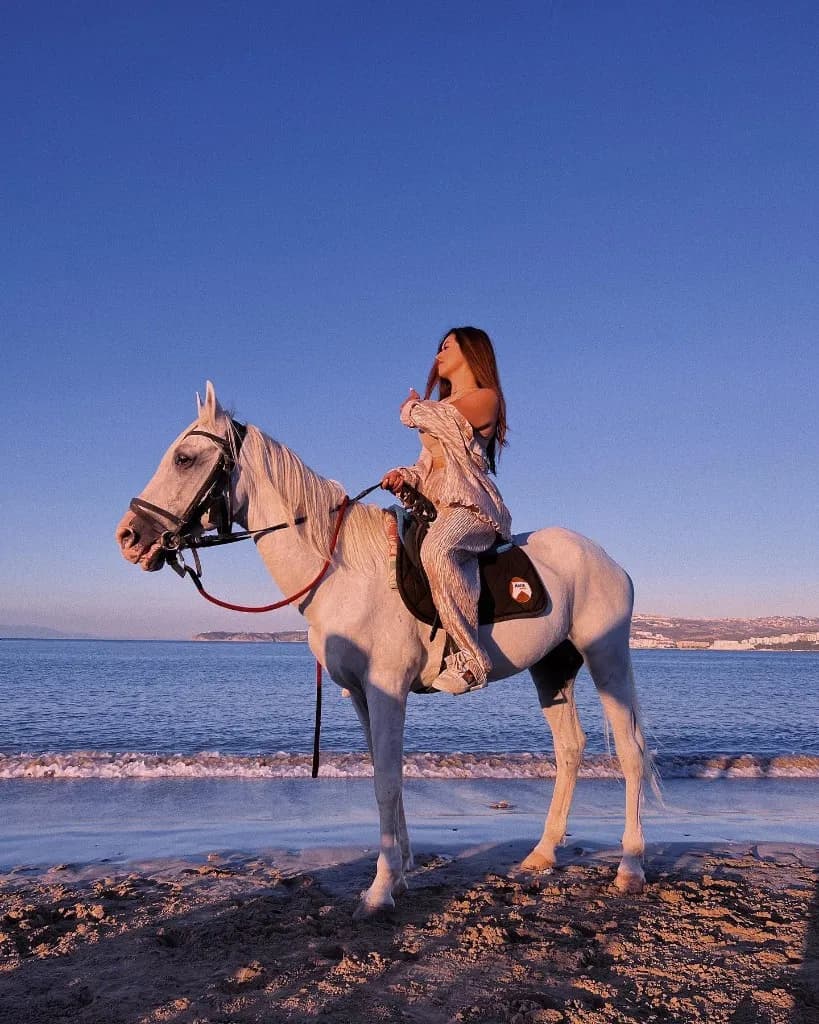 Horse riding on the beach near Agadir at sunset